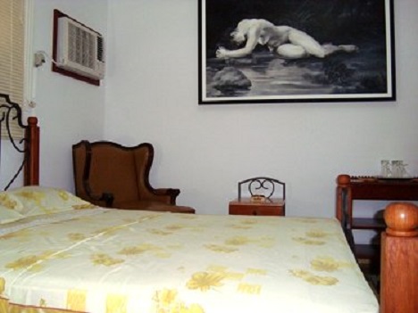'Bedroom in the house of the owners (below the independent apartment)' Casas particulares are an alternative to hotels in Cuba.